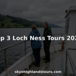 Tourists enjoying Loch Ness boat tour