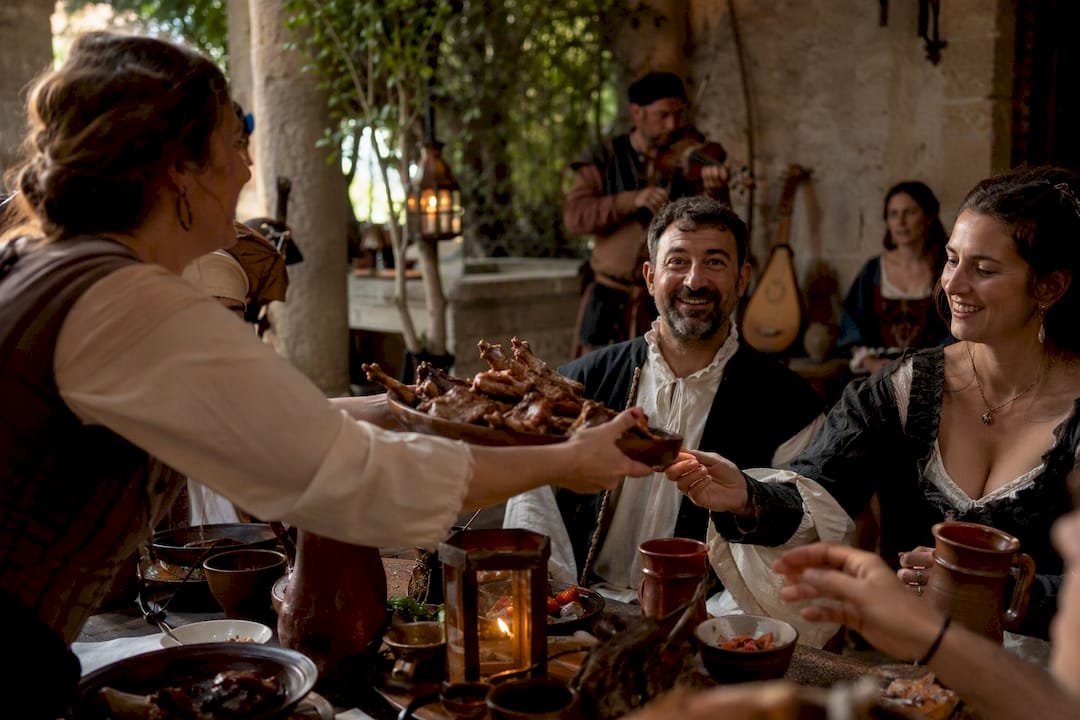 Serving food in medieval banquet hall