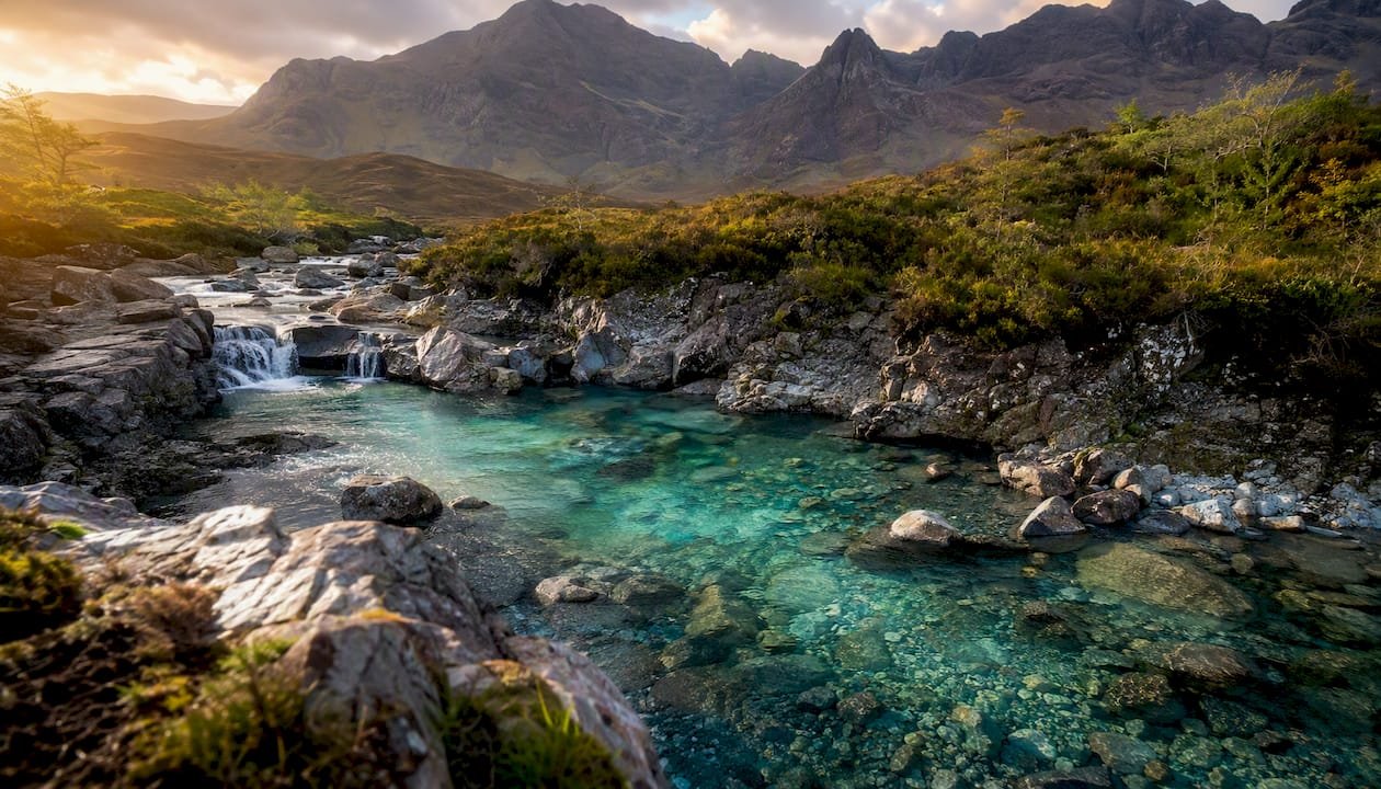 Turquoise Fairy Pools with rocky banks on Skye